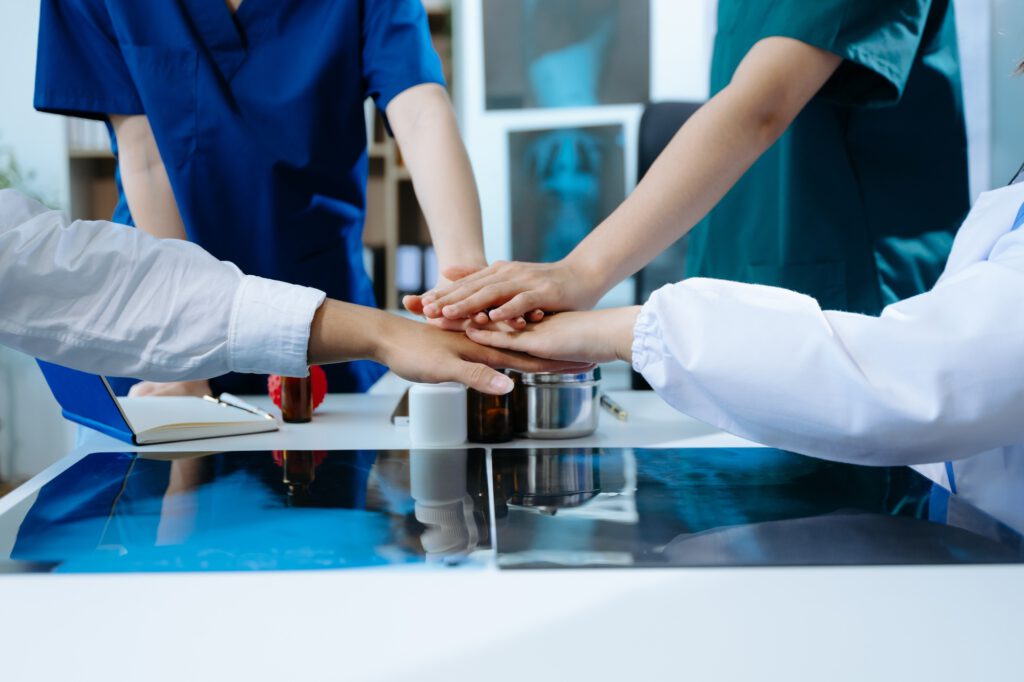 Team Doctors nurses union coordinate hands Teamwork Concept for success and trust in the team.